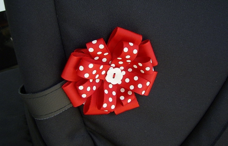 Kwiatek na budce wózka Roan